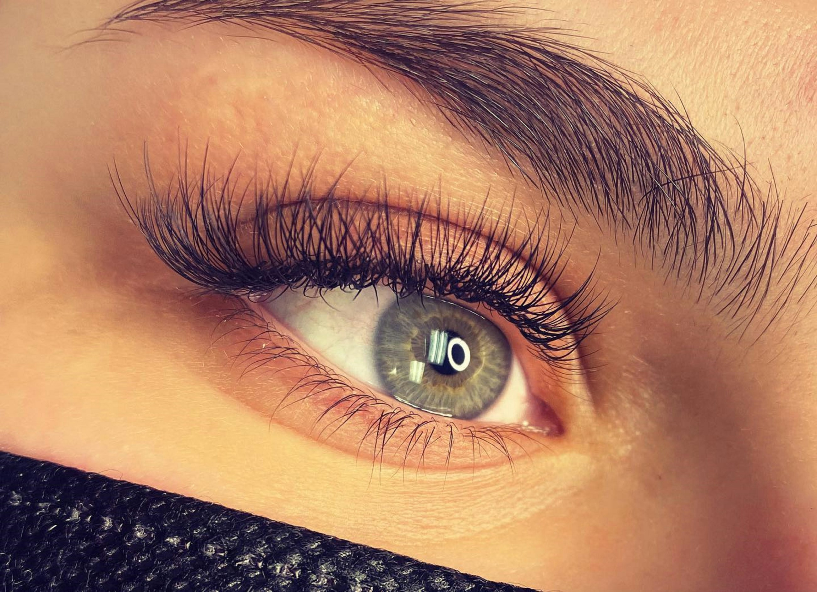 Lash extension close-up placeholder supporting spoolie and lash care education